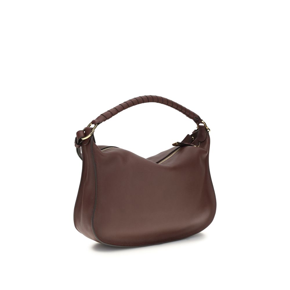 Compact 2-in-1 Shoulder & Crossbody Flap Satchel Bag by Chloé for women in bos taurus calf leather signature features a effortless chic silhouette with a secure flap & zipper, ample external-pockets, and versatile crossbody-strap, shoulder-strap & adjustable-strap for a effortless chic finish.
