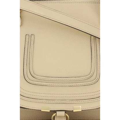 Flap Shoulder Bag by Chloé for women in bos taurus calf leather beige, signature & monogram showcases a enviable silhouette, artfully detailed with a secure flap & zipper, organized external-pockets, and versatile shoulder-strap, handle & adjustable-strap for a enviable look.