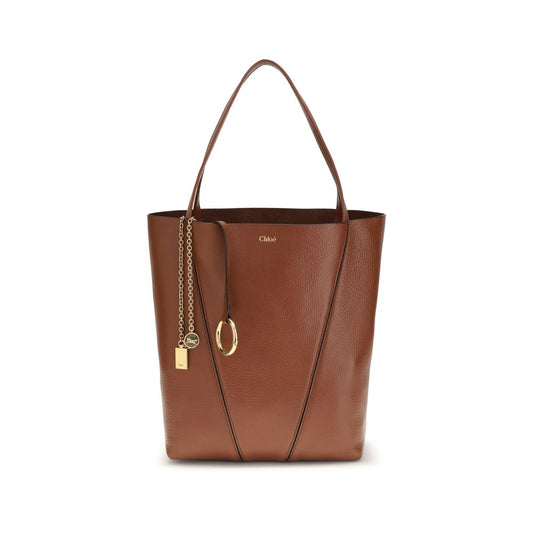 Shoulder Bag by Chloé for women in bos taurus calf grained leather brown & monogram features a enviable silhouette, showcasing a secure , ample single-compartment, and enviable shoulder-strap & handle for a enviable finish.