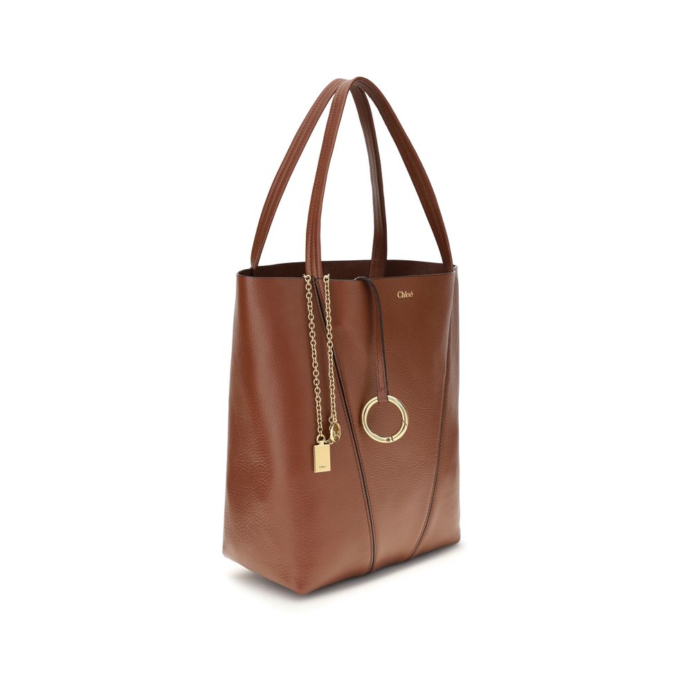 Shoulder Bag by Chloé for women in bos taurus calf grained leather brown & monogram presents a versatile silhouette, showcasing a secure and versatile single-compartment with versatile shoulder-strap & handle for a sophisticated look.