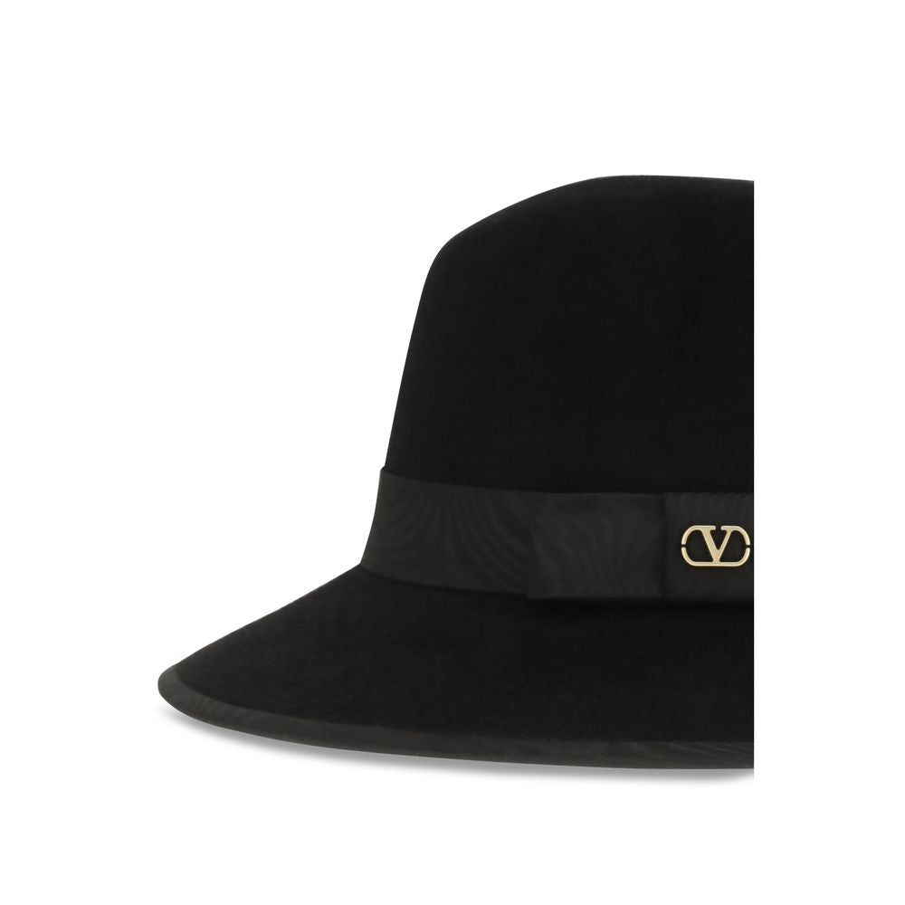 Fedora by Valentino Garavani for women in cotton velvet black & signature features an effortlessly chic silhouette, perfectly showcasing the sophisticated effortlessly chic design of this Fedora Ribbon V Logo Cotton Velvet.