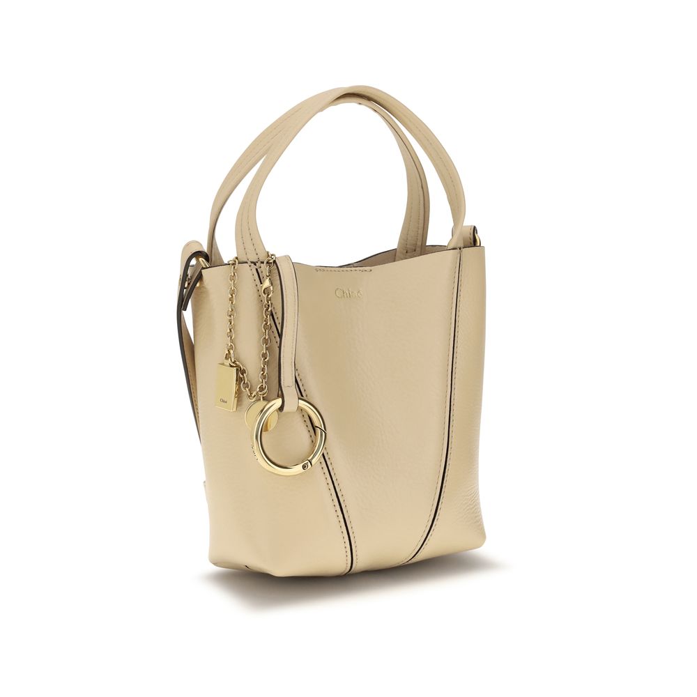 Shoulder Bag by Chloé for women in bos taurus grained leather beige, monogram & print showcases a enviable silhouette, artfully detailed with a secure magnetic & button, organized single-compartment, and versatile shoulder-strap, handle & adjustable-strap for a enviable look.