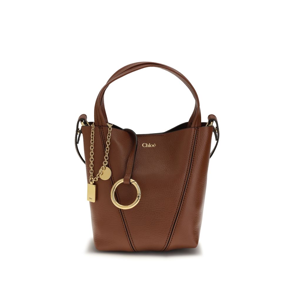 Shoulder Bag by Chloé for women in bos taurus grained leather brown & monogram features a enviable silhouette, showcasing a secure magnetic & button, ample single-compartment, and enviable shoulder-strap, handle & adjustable-strap for a enviable finish.