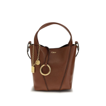 Shoulder Bag by Chloé for women in bos taurus grained leather brown & monogram features a enviable silhouette, showcasing a secure magnetic & button, ample single-compartment, and enviable shoulder-strap, handle & adjustable-strap for a enviable finish.