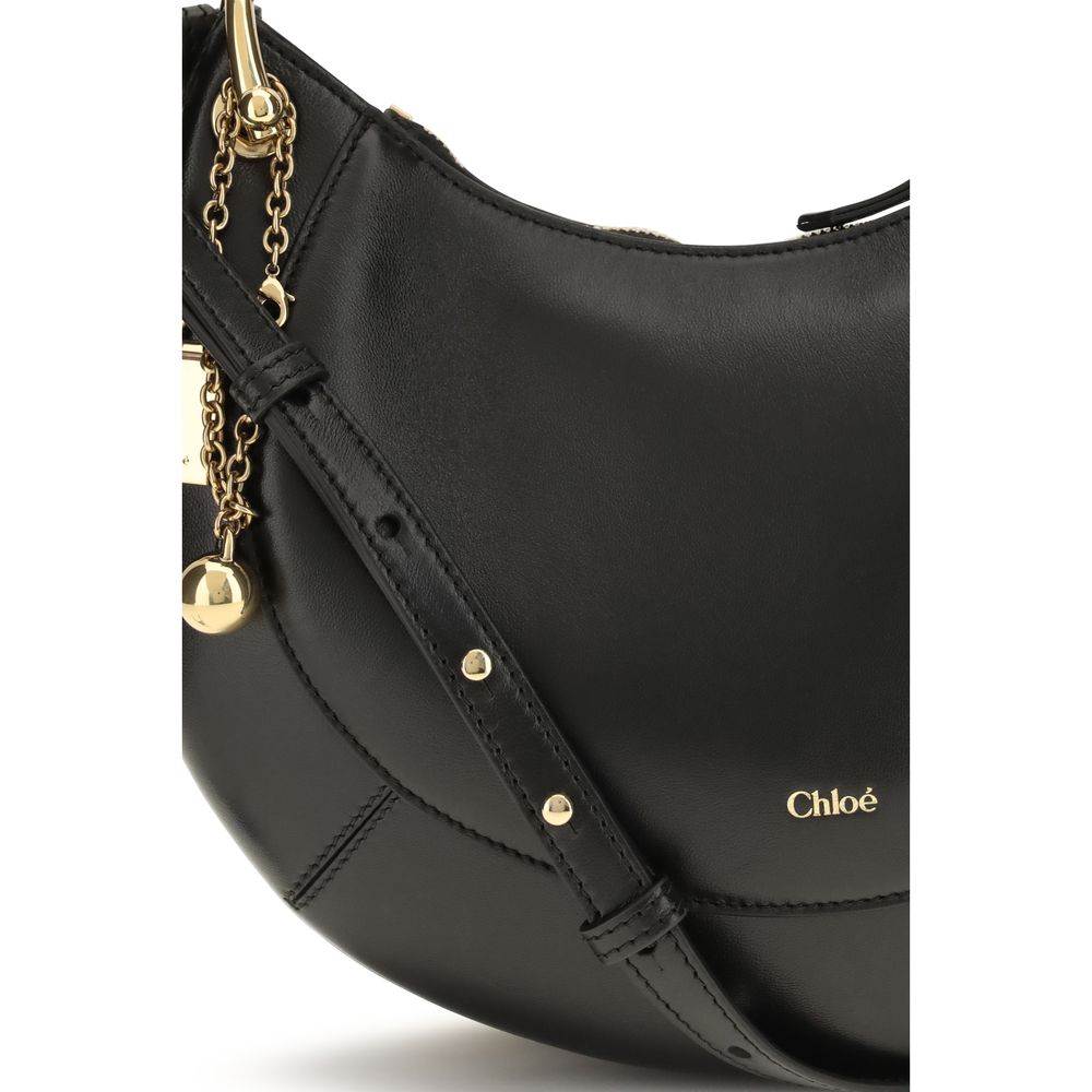 Shoulder Bag by Chloé for women in bio-acetate cotton & bos taurus calf leather black & signature features an effortlessly chic silhouette with a secure buckle, ample cardholder, and versatile shoulder-strap & adjustable-strap for effortlessly chic everyday luxury.