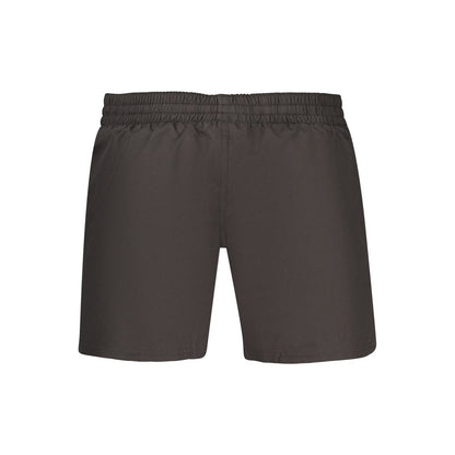 Swim Shorts by Nike for men in polyester and black showcases a sinuous silhouette, expertly cut for a sinuous fit as part of the Waves Men's Polyester Swim Shorts collection.