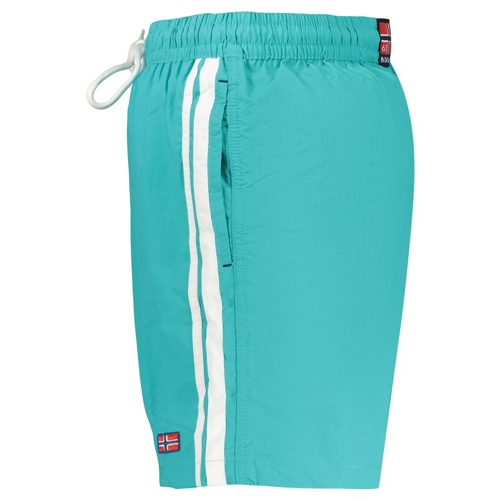 Swim Shorts by Norway 1963 for men in polyamide blue presents a beach chic silhouette from the Men's Polyamide Swim Shorts collection, showcasing a beach chic cut for a refined poolside look.