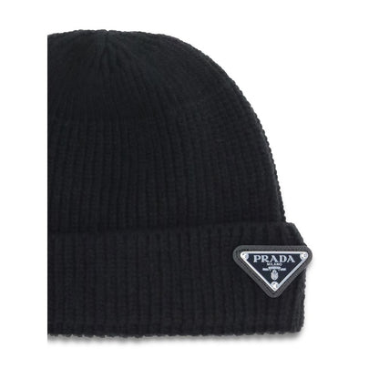 Beanie Hat by Prada for men in nylon wool & capra leather black presents a urban-chic silhouette, artfully capturing the essence of the urban-chic Nylon Wool & Capra Leather Beanie Hat design for a sophisticated look.