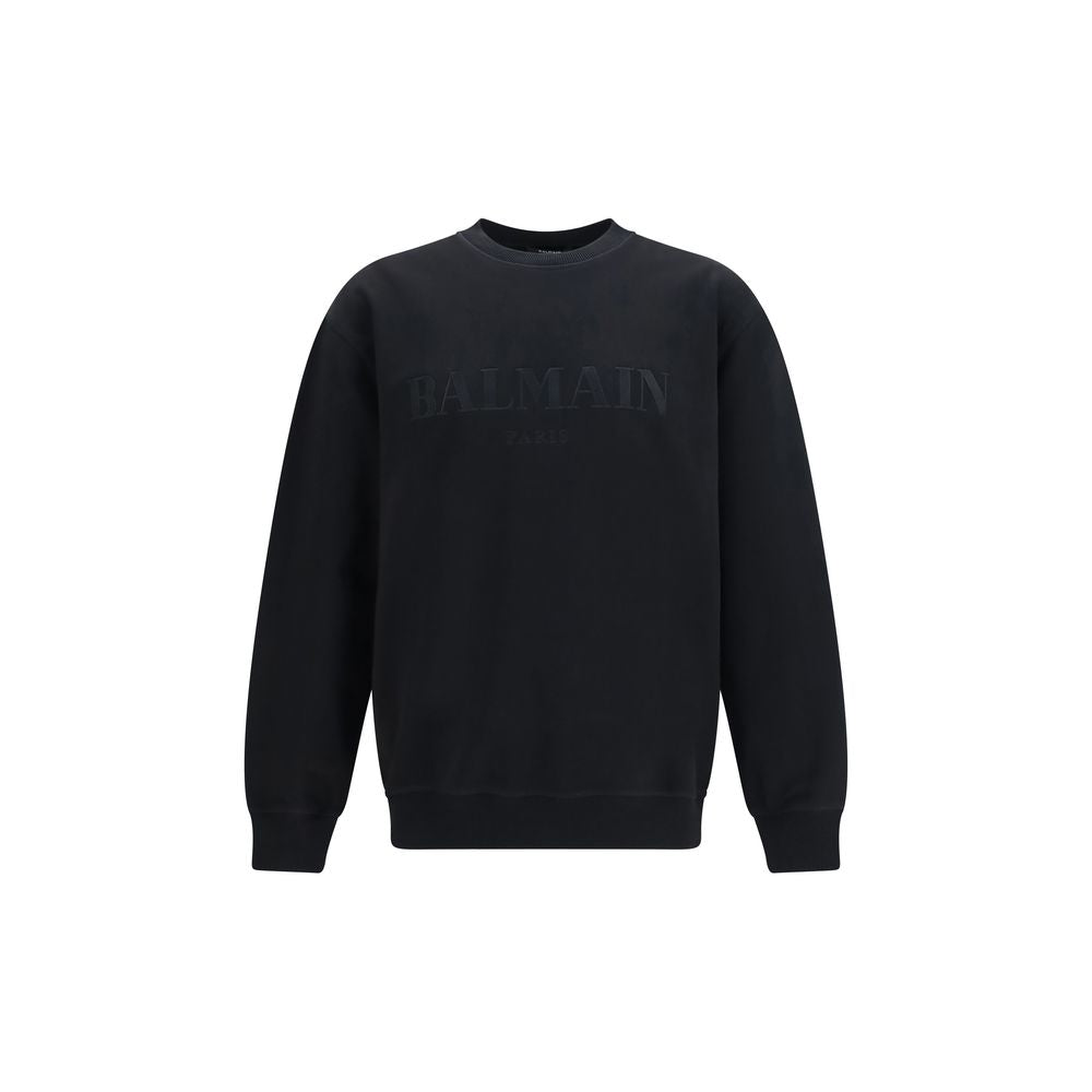 Sweatshirt by Balmain for men in cotton black features an provocated silhouette, detailed with a provocated and a refined crew neckline for a sophisticated aesthetic.