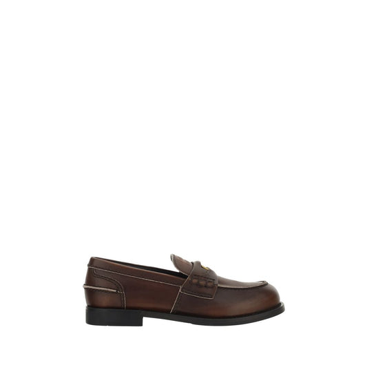 Loafer Slip-On Shoes by Miu Miu for women in bos taurus calf leather brown & signature features an effortless chic silhouette, showcasing the Women's Bos Taurus Calf Leather Loafer Slip-On Shoes design with an effortless chic block-heel and a for a effortless chic look.