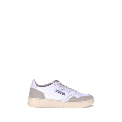 Sneakers by Autry for men in bos taurus calf suede leather white & signature presents a impeccable silhouette as Men's Low Top Bos Taurus Calf Suede Leather Sneakers, expertly defined by a impeccable low-top style for a impeccable, high-fashion look.