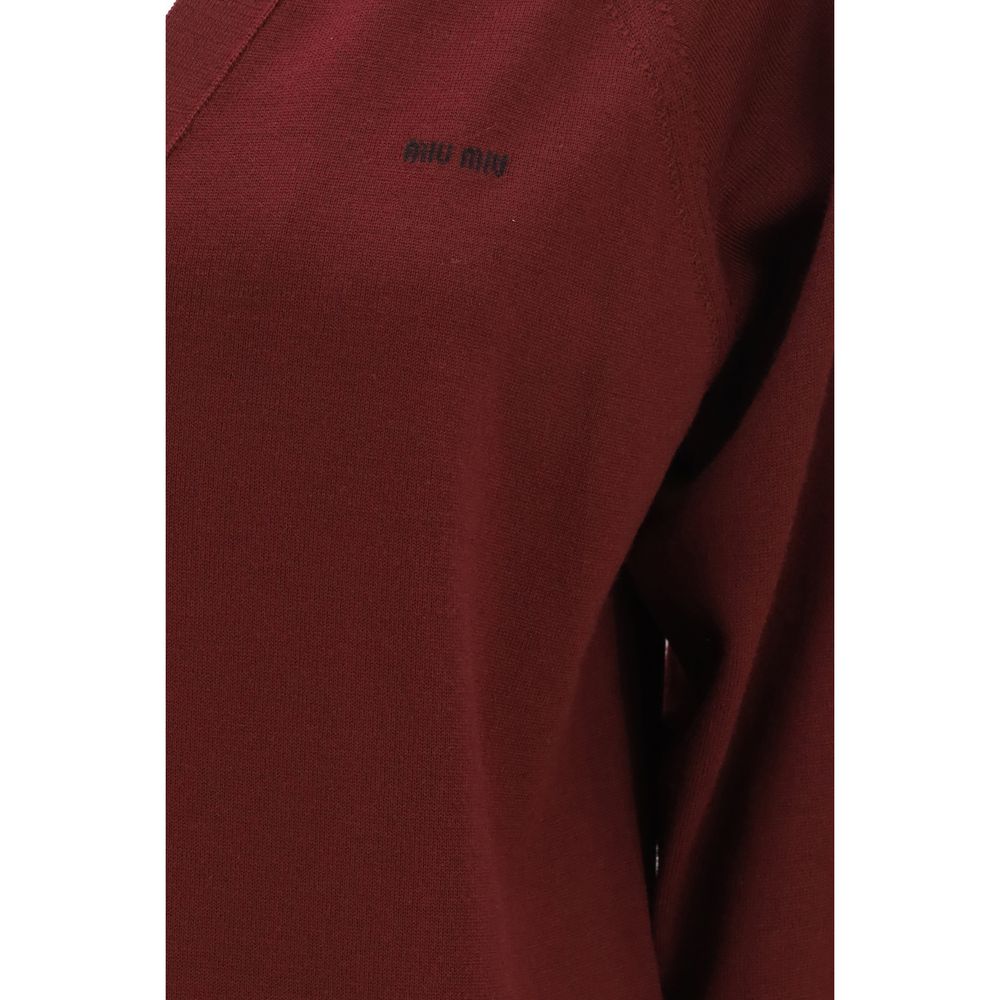 Cardigan by Miu Miu for women in virgin wool bordeaux & signature showcases a captivating silhouette, artfully detailed with a captivating and for a truly sophisticated captivating look.