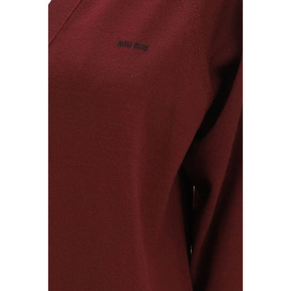 Cardigan by Miu Miu for women in virgin wool bordeaux & signature showcases a captivating silhouette, artfully detailed with a captivating and for a truly sophisticated captivating look.