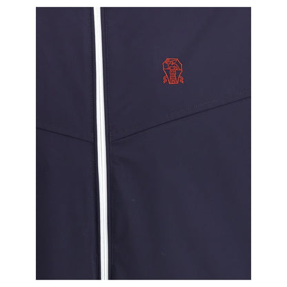 Hooded Windbreaker Jacket by Brunello Cucinelli for men in stretch polyamide blue presents a resilient silhouette, artfully detailed with a sophisticated and functional water-resistant, pockets, hooded & windproof for a resilient finish.