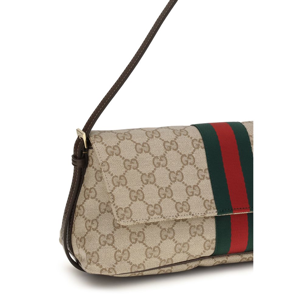 Medium Shoulder Handbag by Gucci for women in cotton & leather beige, brown, signature & striped features an refined silhouette, showcasing a secure snap, zipper & magnetic, ample , and versatile shoulder-strap & adjustable-strap for a sophisticated refined aesthetic.