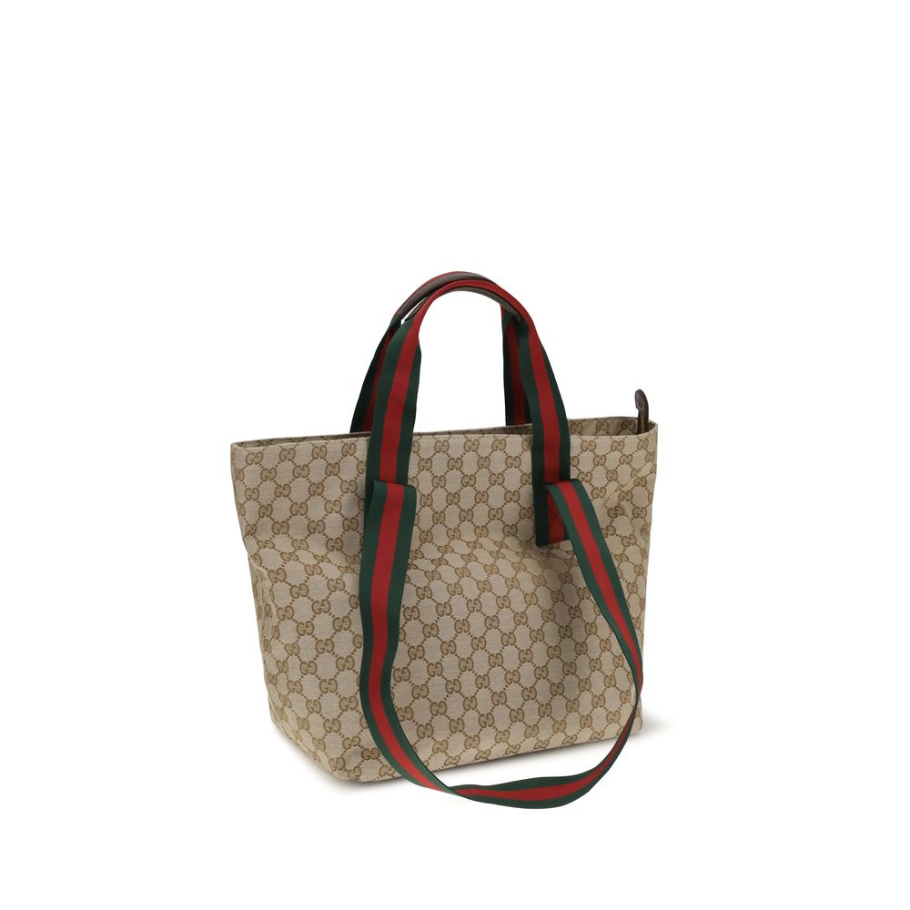 Small Tote Shoulder Bag by Gucci for men in polyester leather cotton canvas beige, brown, green, red, patterned, signature, print & striped showcases a enviable silhouette, artfully detailed with a secure zipper, organized , and versatile handle for a enviable look.
