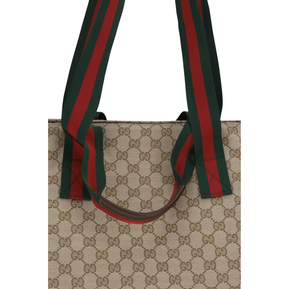 Small Tote Shoulder Bag by Gucci for men in polyester leather cotton canvas beige, brown, green, red, patterned, signature, print & striped features a distinguished silhouette, showcasing a secure zipper and distinguished with versatile handle for a distinguished finish.