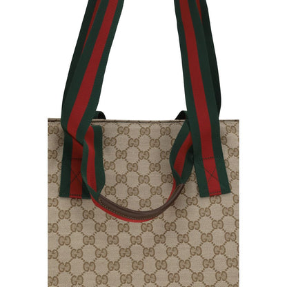 Small Tote Shoulder Bag by Gucci for men in polyester leather cotton canvas beige, brown, green, red, patterned, signature, print & striped features a distinguished silhouette, showcasing a secure zipper and distinguished with versatile handle for a distinguished finish.