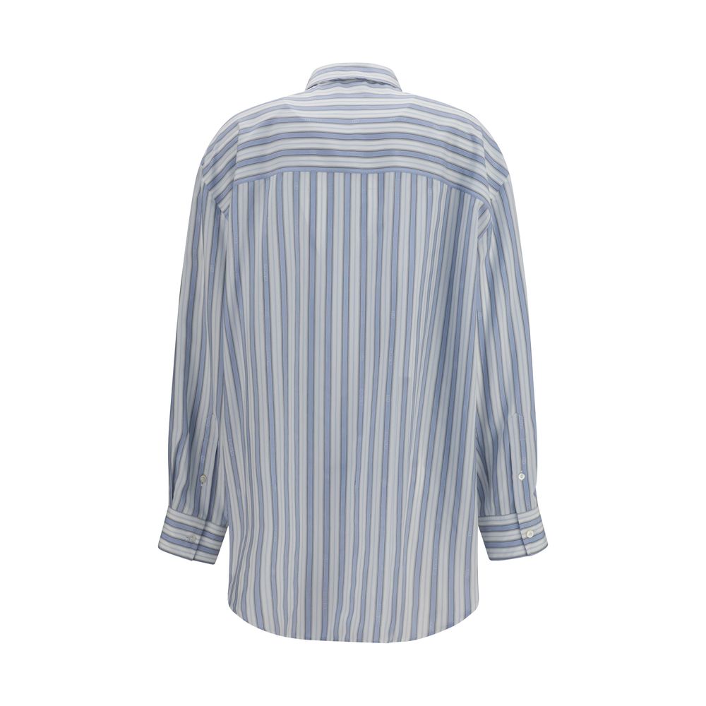 Shirt by Gucci for women in silk light-blue, white, patterned, jacquard & striped showcases a sleek silhouette, elegantly detailed with a sleek and for a sleek finish.