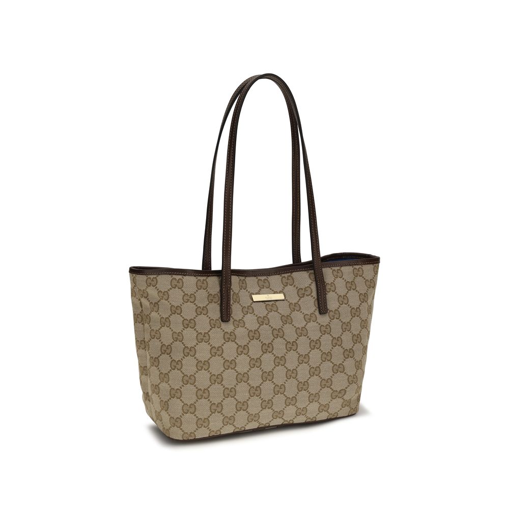 Large Tote Handbag by Gucci for women in leather beige features an refined silhouette, showcasing a secure snap & button, ample , and versatile for a sophisticated refined aesthetic.