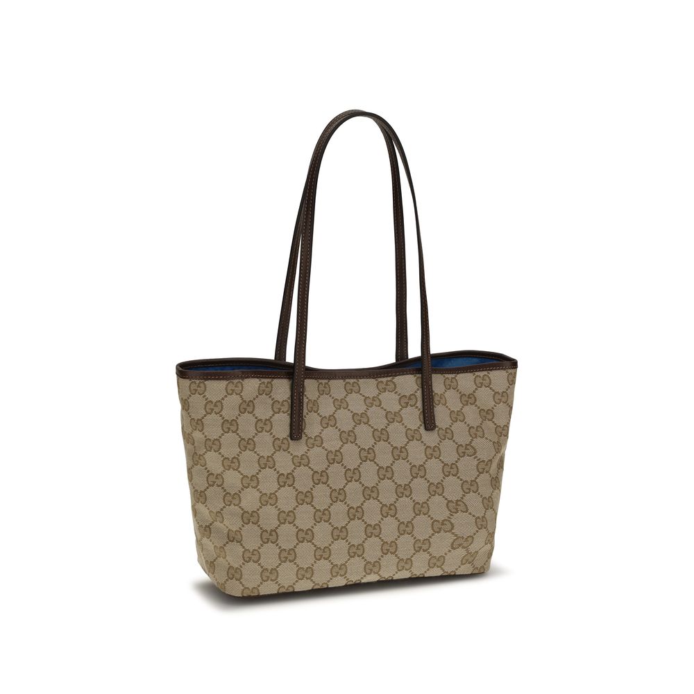 Large Tote Handbag by Gucci for women in leather beige features a refined silhouette, showcasing a secure snap & button, organized , and versatile for a refined finish.