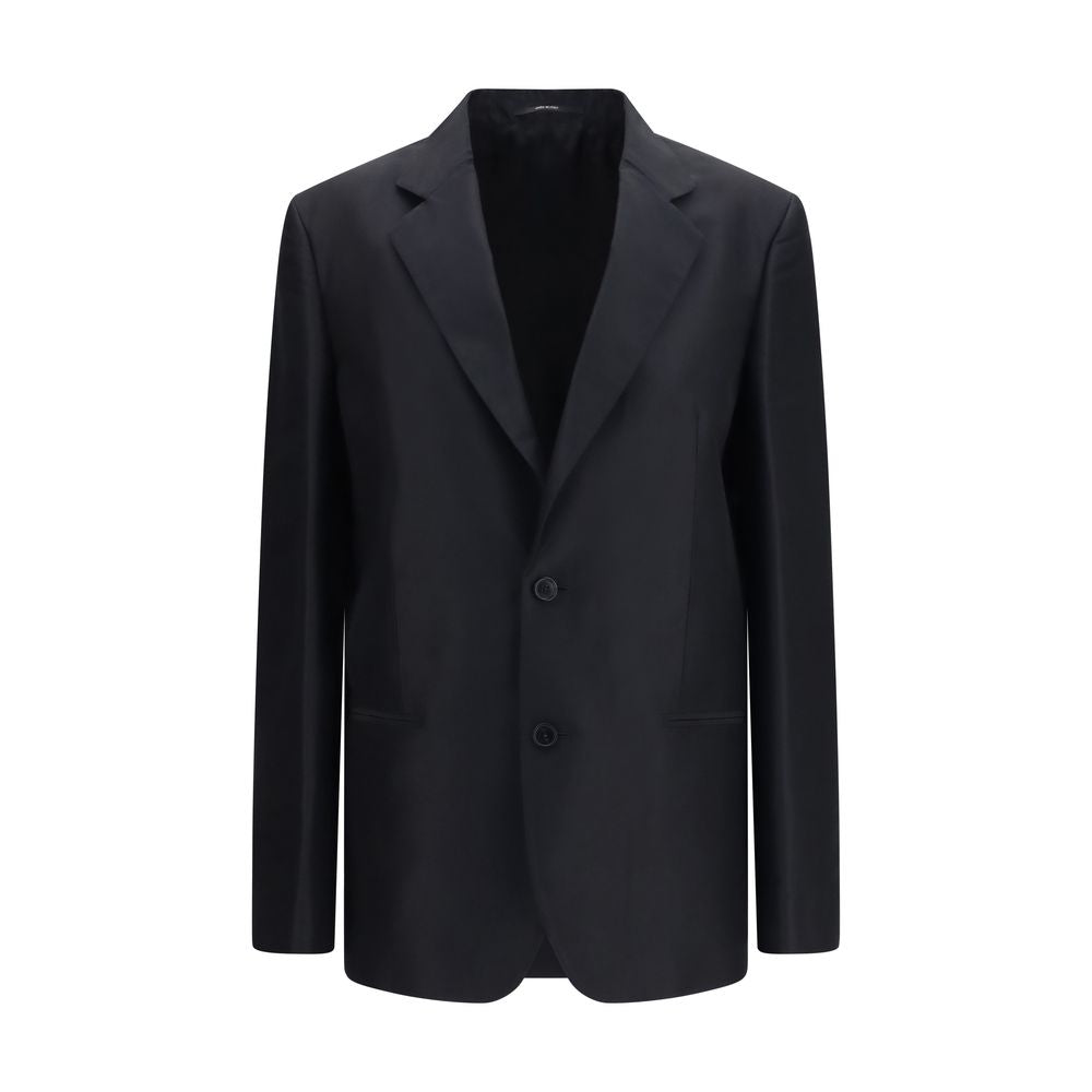 Jacket by Gucci for women in silk black presents a impeccable silhouette, showcasing distinct pockets and a impeccable for a sophisticated finish.