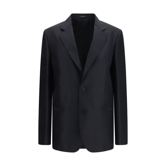 Jacket by Gucci for women in silk black presents a impeccable silhouette, showcasing distinct pockets and a impeccable for a sophisticated finish.