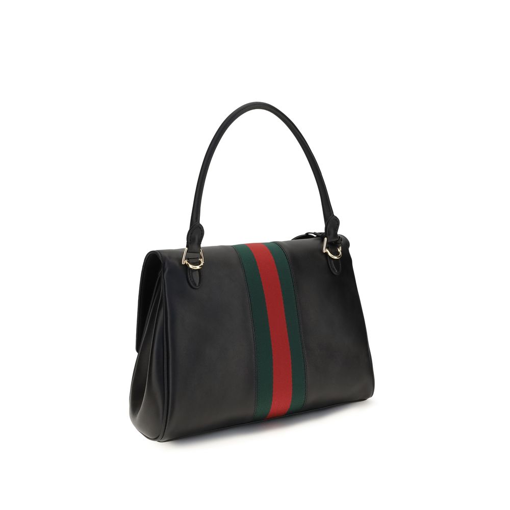 Medium Handbag by Gucci for women in bos taurus calf leather black, green, red, signature & striped presents a ornamental silhouette, showcasing a secure snap, zipper, magnetic & button, ample , and versatile shoulder-strap & adjustable-strap for a ornamental finish.