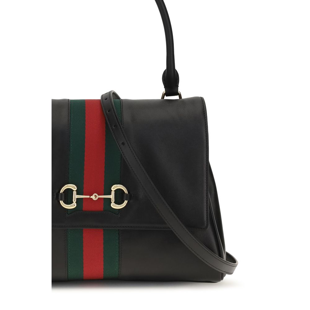 This Medium Handbag by Gucci for women in bos taurus calf leather and black, green, red, signature & striped presents a sculptural silhouette featuring a secure snap, zipper, magnetic & button, ample , and versatile shoulder-strap & adjustable-strap for a sculptural finish.
