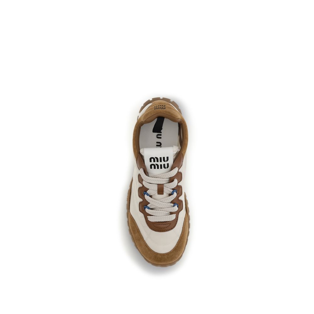 Athletic Sneakers by Miu Miu for women in eva polyamide & bos taurus suede calf leather beige showcases an impeccable silhouette, defined by an impeccable athletic style design that perfectly captures the essence of the Star Women's Athletic EVA Polyamide & Bos Taurus Suede Calf Leather Sneakers.