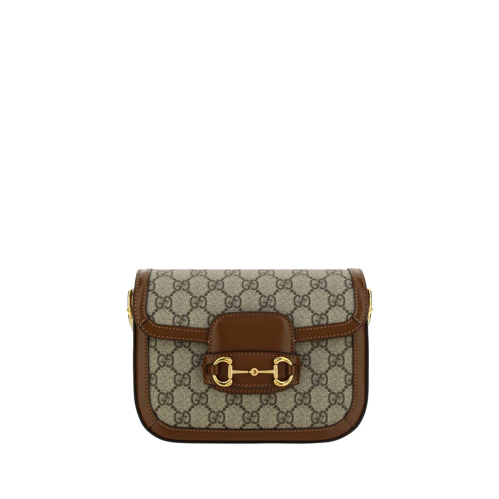 Mini 2-in-1 Shoulder & Crossbody Flap Clutch Handbag by Gucci for women in polyester polyethylene polyethylene & cotton brown, patterned, signature & striped presents a ornamental silhouette, showcasing a secure flap, ample , and versatile crossbody-strap, shoulder-strap & adjustable-strap for a ornamental finish.