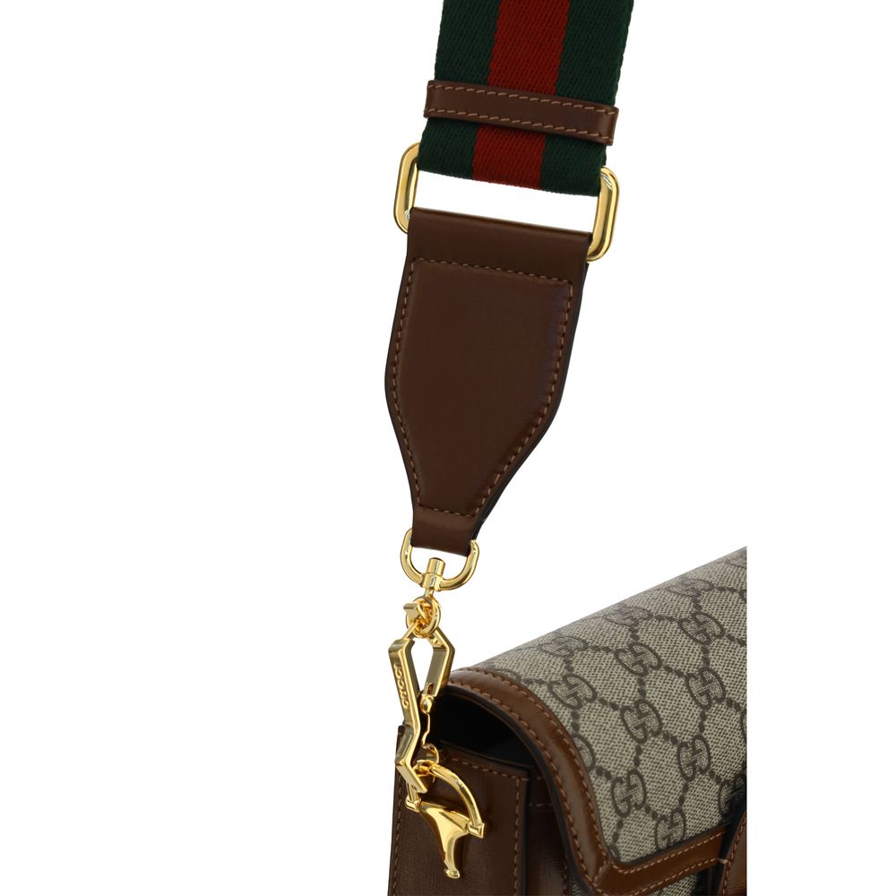 Mini 2-in-1 Shoulder & Crossbody Flap Clutch Handbag by Gucci for women in polyester polyethylene polyethylene & cotton brown, patterned, signature & striped features a contemporary silhouette, showcasing a secure flap, ample , and contemporary crossbody-strap, shoulder-strap & adjustable-strap for a sophisticated look.