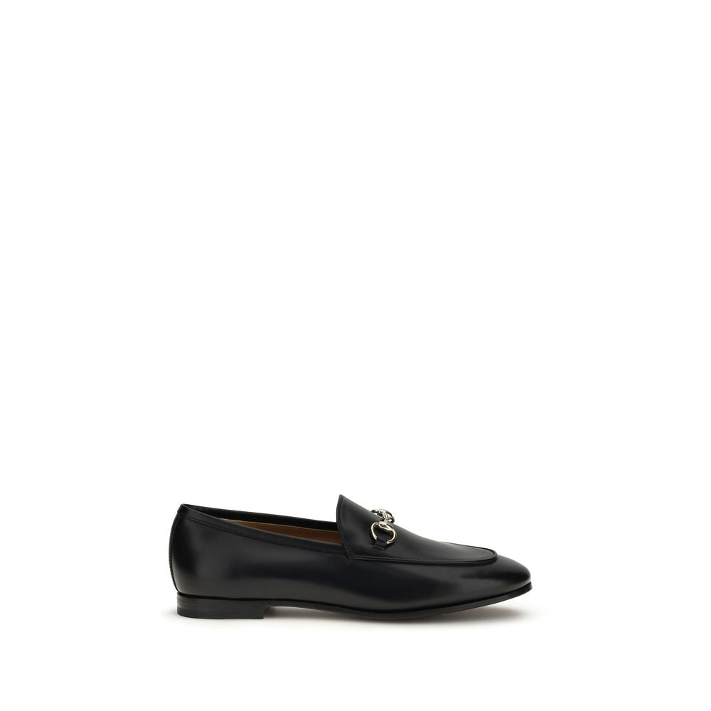 Flat Loafer Slip-On Shoes by Gucci for women in bos taurus calf leather black & gold showcases a timeless silhouette from the Horsebit Women's Bos Taurus Calf Leather Flat Loafer Slip-On Shoes collection, featuring a timeless flat and for a timeless finish.