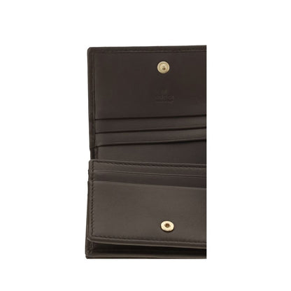 Cardholder Wallet by Gucci for women in bos taurus calf nappa leather brown, gold, patterned & chevron showcases a discerning silhouette, artfully capturing the essence of Gg Marmont Bos Taurus Calf Nappa Leather Cardholder Wallet with its functional card-organization.