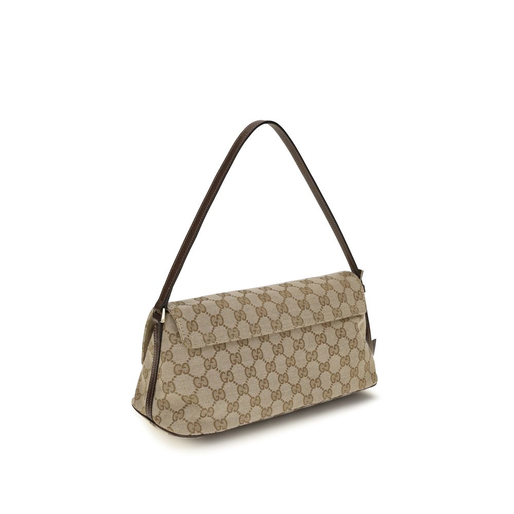 Medium Shoulder Handbag by Gucci for women in leather blue, brown, gold & patterned features a contemporary silhouette, showcasing a secure snap, zipper & magnetic, ample , and contemporary shoulder-strap & adjustable-strap for a sophisticated look.
