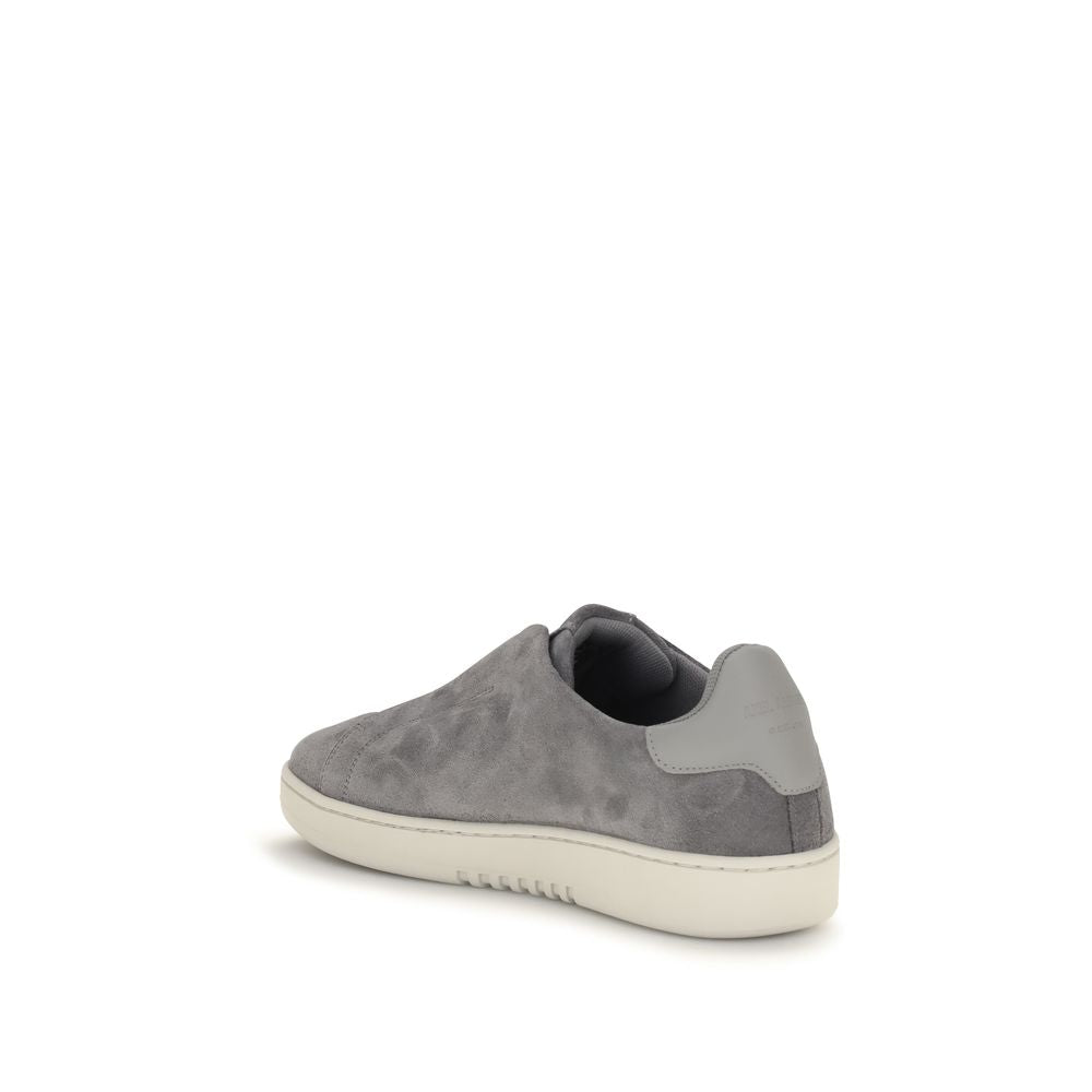 Sneakers by Axel Arigato for men in bos taurus calf suede leather gray & signature features a chic design, perfectly showcasing the chic low-top slip-on style of this Men's Low Top Slip On Bos Taurus Calf Suede Leather Sneakers.