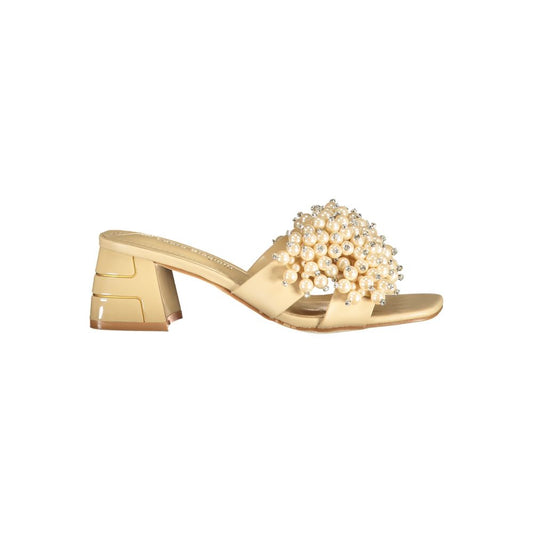 Mid-Heel Sandals by Laura Biagiotti for women in polyurethane & rhinestone beige & pearl showcases a sculptural silhouette as Women's Polyurethane & Rhinestone Mid-Heel Sandals, defined by a sculptural 5-cm-heel mid-heel and sculptural for a sculptural look.