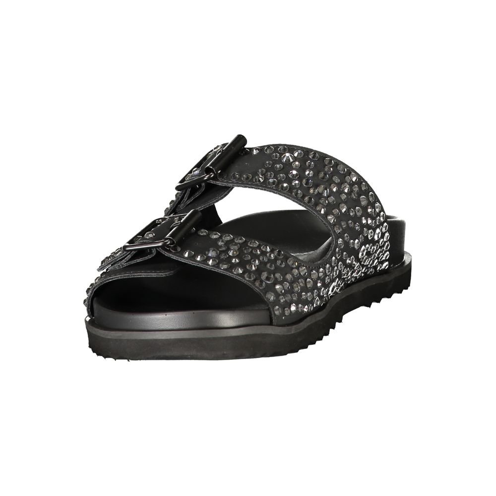 Flat Sandals by Laura Biagiotti for women in polyurethane & rhinestone black showcases a sculptural silhouette as Women's Polyurethane & Rhinestone Flat Sandals, defined by a sculptural flat and sculptural for a sculptural look.