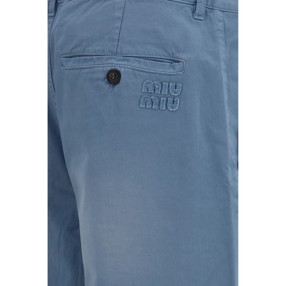 Casual Pants by Miu Miu for women in cotton blue presents a refined pantology silhouette, artfully defined by a refined pantology straight, regular-fit & wide, long, and a sophisticated mid rise.