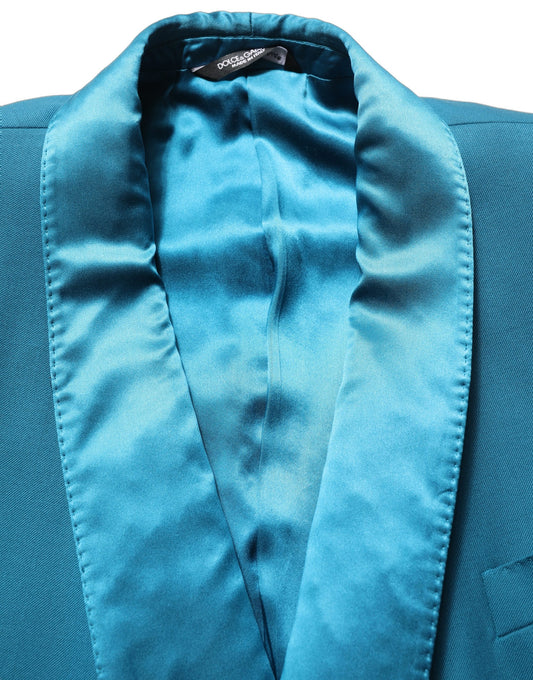 This Blazer by Dolce & Gabbana for men in wool & silk satin blue & teal presents a tailored silhouette, meticulously tailored with a tailored wrap double-breasted neckline and distinctive for a tailored finish.