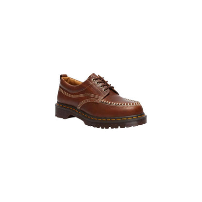 Shoes by Dr. Martens for men in leather & rubber brown & yellow showcases a timeless silhouette as Men's Leather & Rubber Shoes, artfully designed with a timeless and refined for a timeless finish.