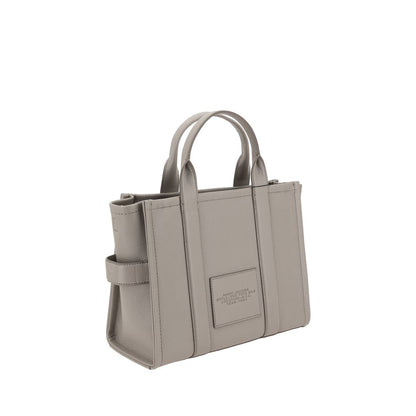 Medium Tote Handbag by Marc Jacobs for women in bos taurus calf grained leather gray & monogram features a refined silhouette, showcasing a secure zipper, organized , and versatile shoulder-strap, handle & adjustable-strap for a refined finish.