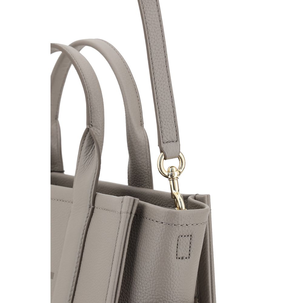 Medium Tote Handbag by Marc Jacobs for women in bos taurus calf grained leather gray & monogram features a exquisite silhouette, showcasing a secure zipper and exquisite with versatile shoulder-strap, handle & adjustable-strap for a exquisite finish.