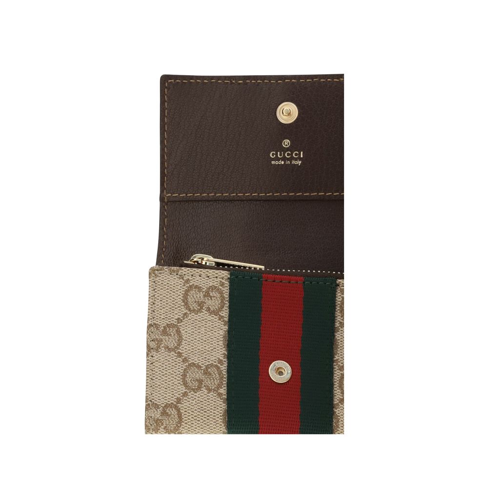 Cardholder Wallet by Gucci for women in fabric beige, gold, signature & striped showcases a discerning silhouette, artfully capturing the essence of Gg Fabric Cardholder Wallet with its functional card-organization compact-design.
