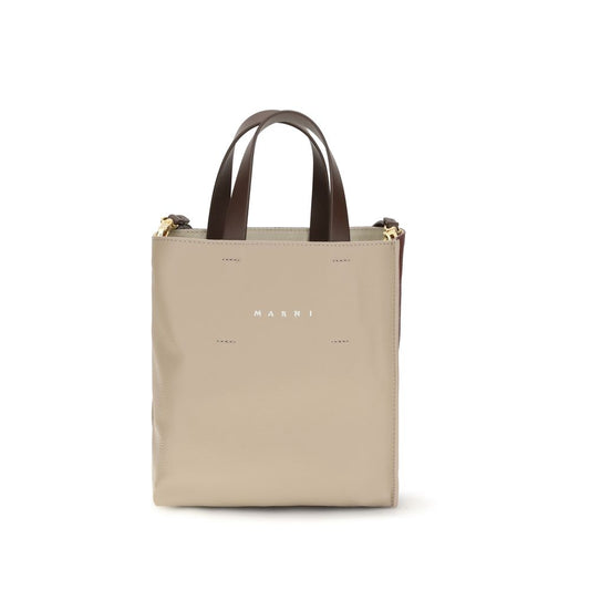 Mini 2-in-1 Shoulder & Crossbody Bag by Marni for women in bos taurus calf leather beige presents a versatile silhouette, showcasing a secure zipper and versatile with versatile crossbody-strap, shoulder-strap, adjustable-strap & handle for a sophisticated look.