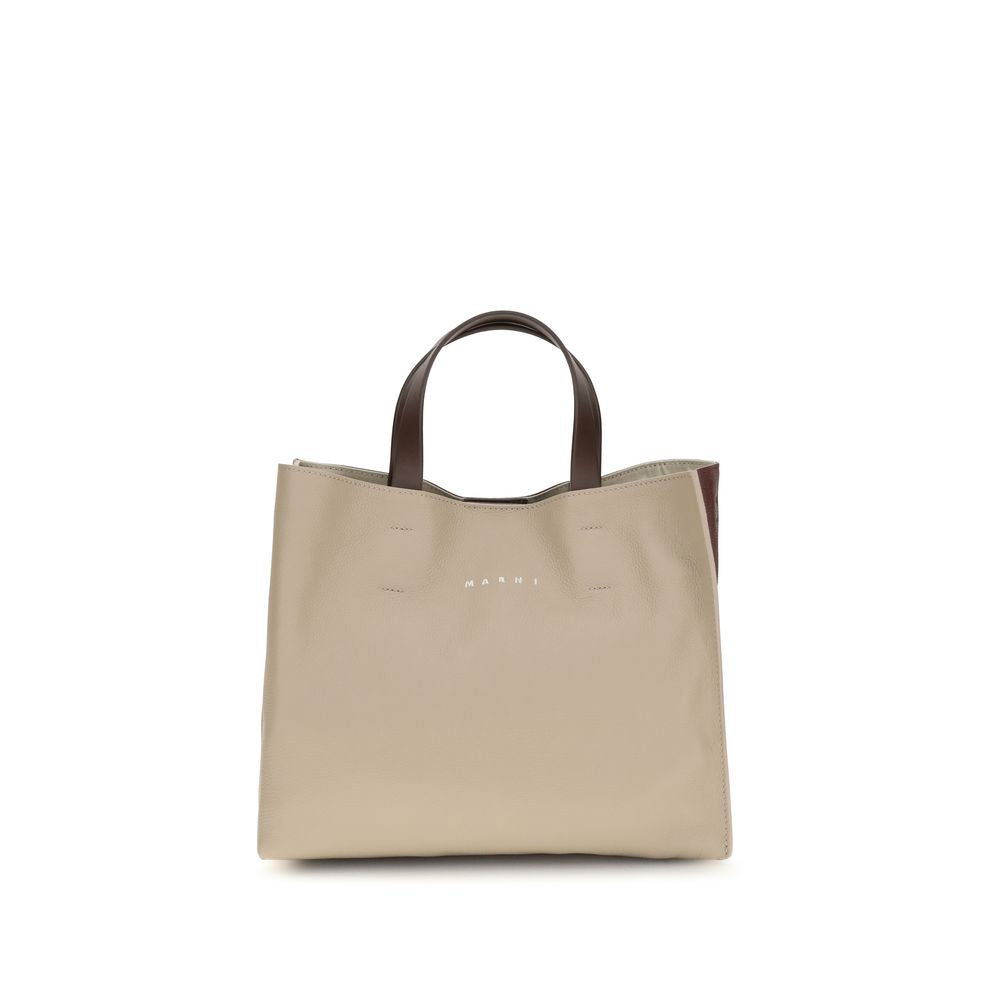 2-in-1 Shoulder & Crossbody East West Tote Bag by Marni for women in bos taurus calf leather beige features an effortlessly chic silhouette with a secure , ample , and versatile crossbody-strap, shoulder-strap, handle & detachable-strap for effortlessly chic everyday luxury.
