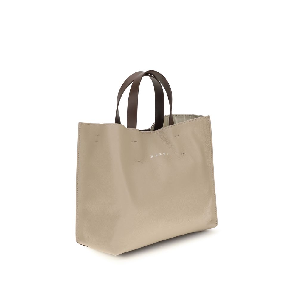2-in-1 Shoulder & Crossbody East West Tote Bag by Marni for women in bos taurus calf leather beige features a effortless sophistication silhouette, secured by a with ample and versatile crossbody-strap, shoulder-strap, handle & detachable-strap for a effortless sophistication finish.
