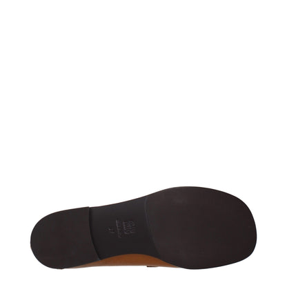 Flat Loafer Slip-On Shoes by Miu Miu for women in leather brown features an effortless chic silhouette, showcasing the Women's Leather Flat Loafer Slip-On Shoes design with an effortless chic flat and a for a effortless chic look.