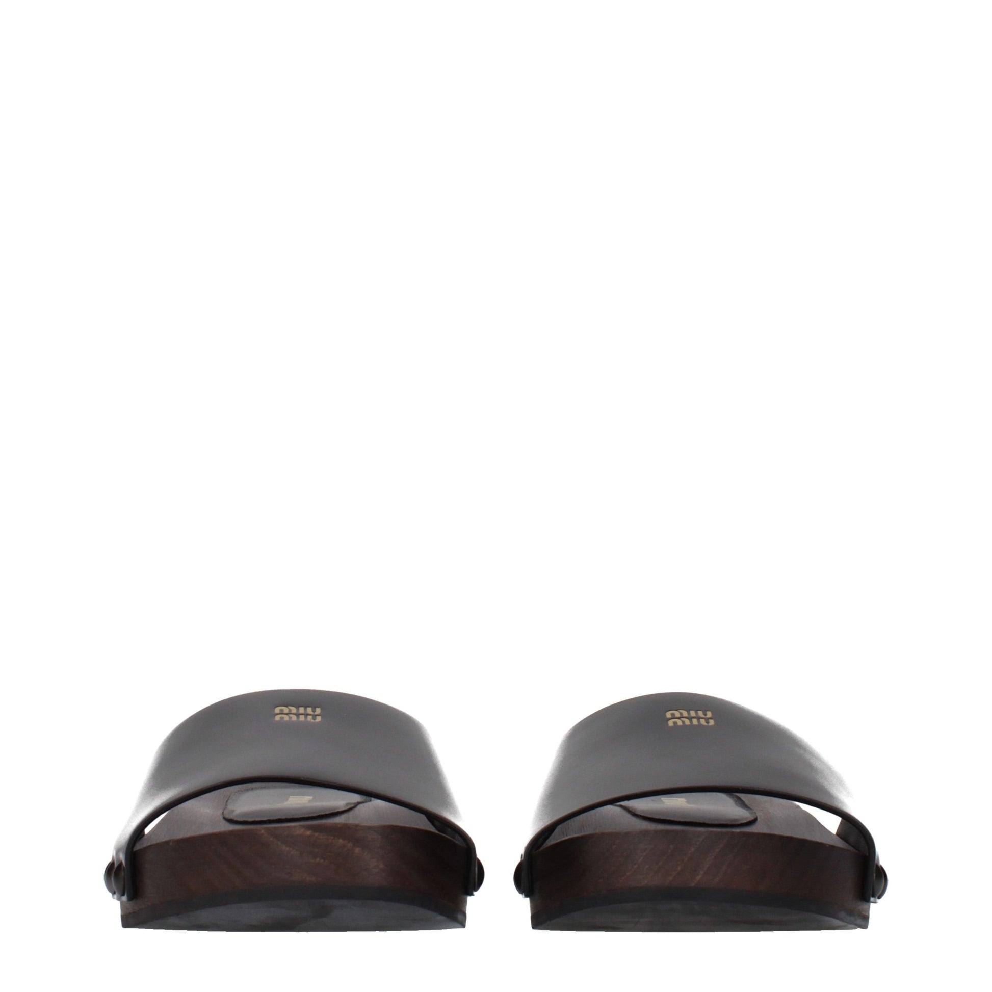 Clogs Slippers by Miu Miu for women in patent leather black presents a effortless silhouette, showcasing the elegant Women's Patent Leather Clogs Slippers design with its unique and sophisticated .