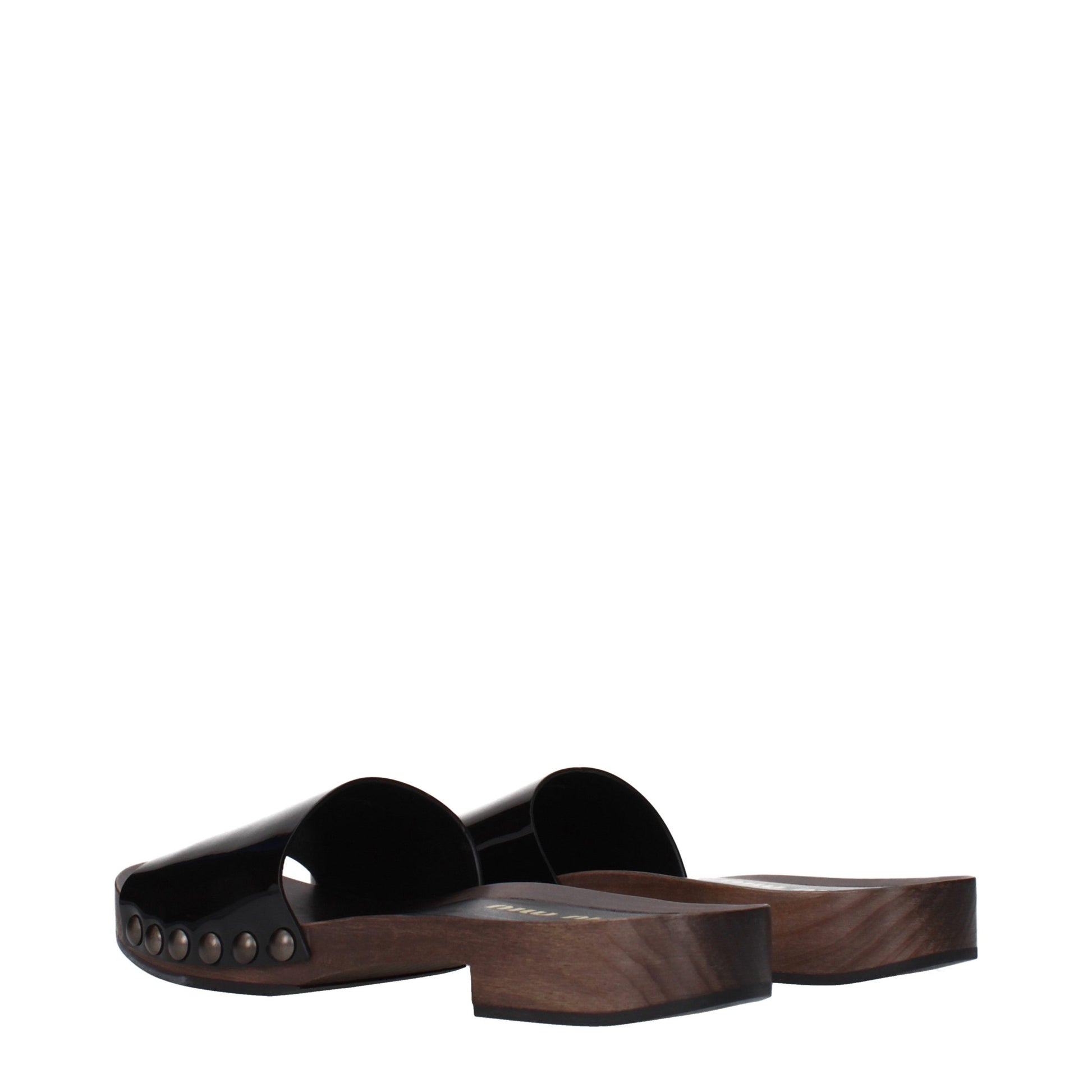 Clogs Slippers by Miu Miu for women in patent leather black features an effortlessly elegant silhouette, showcasing the Women's Patent Leather Clogs Slippers design with an effortlessly elegant and a for a effortlessly elegant look.
